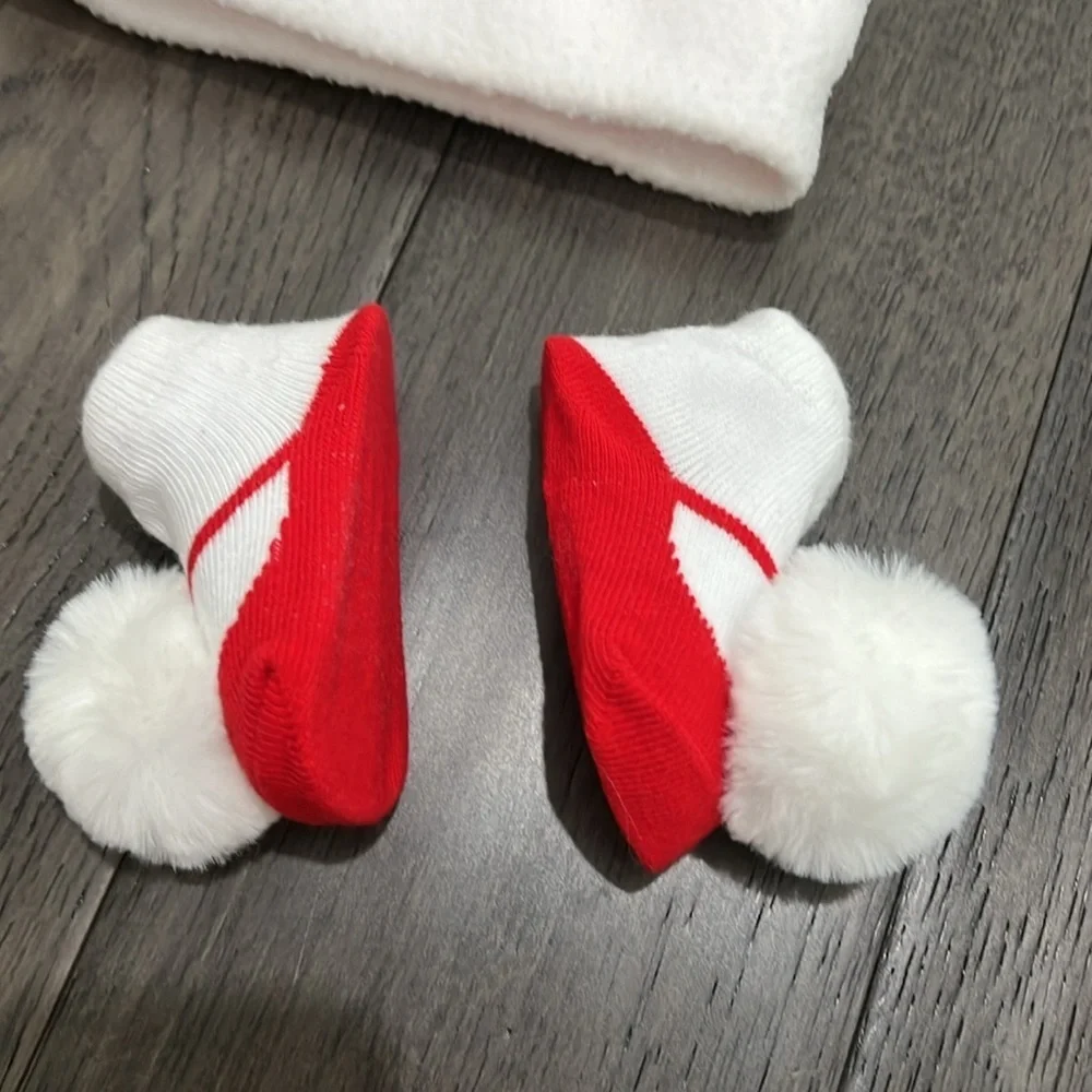 NWOT infant Santa hat with matching sock booties with pom-poms
